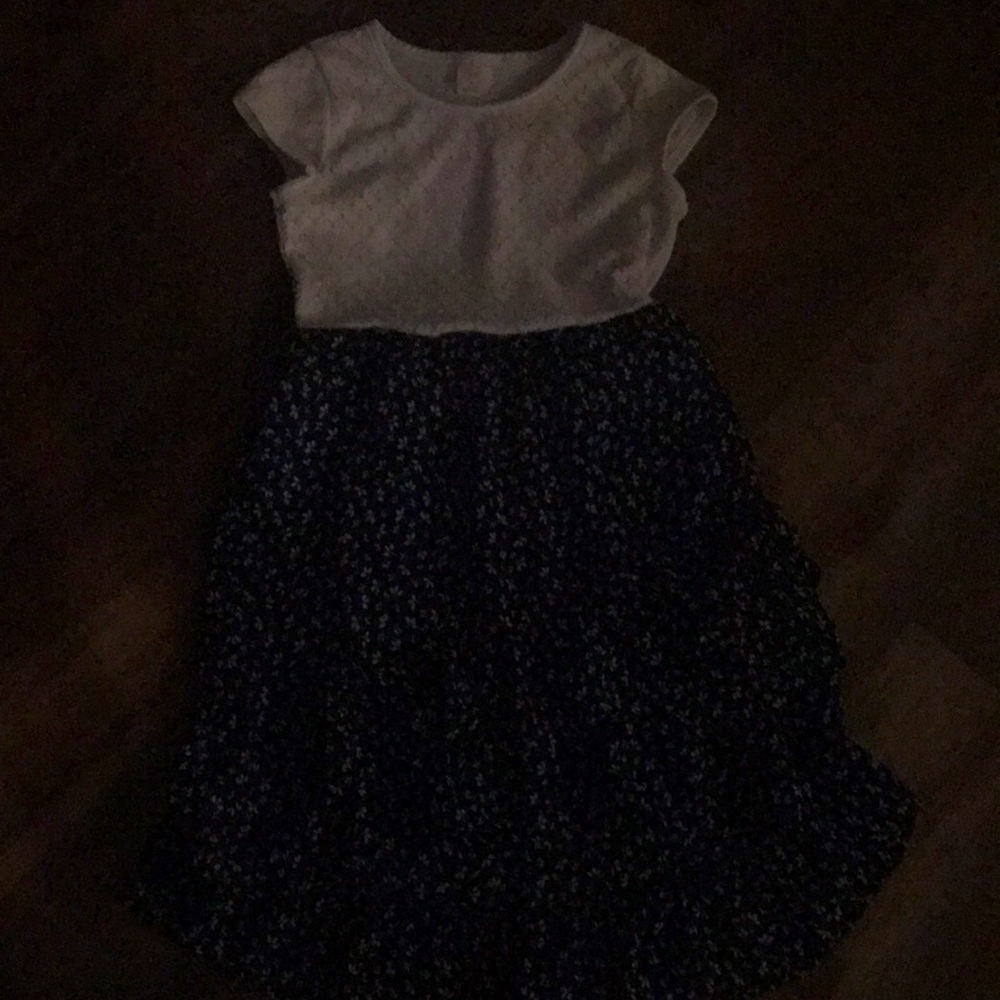 This is a kids dress this is has been used and does have a couple stains.